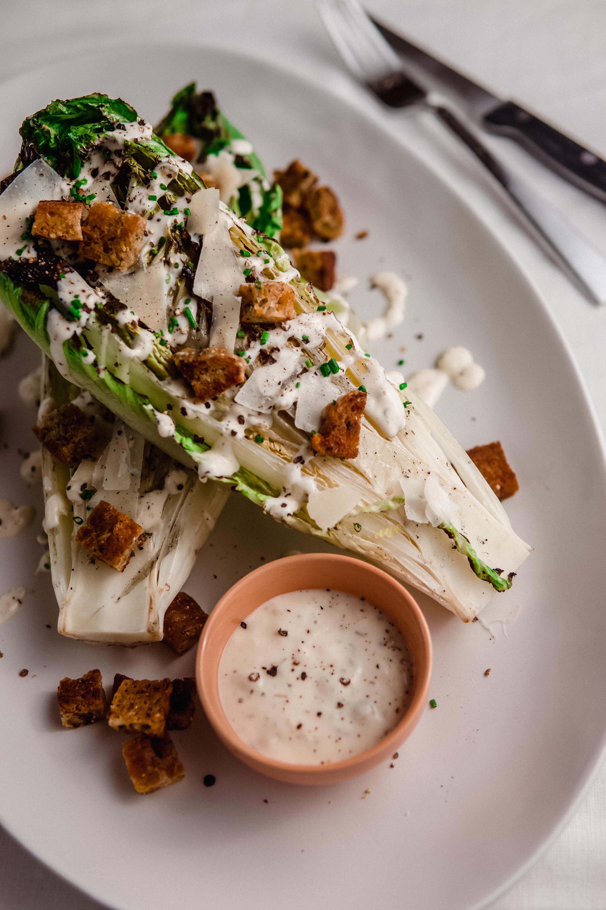 Umami Caesar Dressing on Grilled Romaine Salads